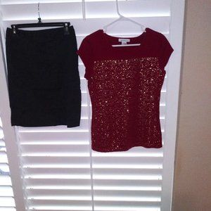 Outfit of black skirt and red top-see details.